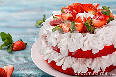 Strawberry and cream sponge cake. Homemade summer dessert on wooden table Stock Photo