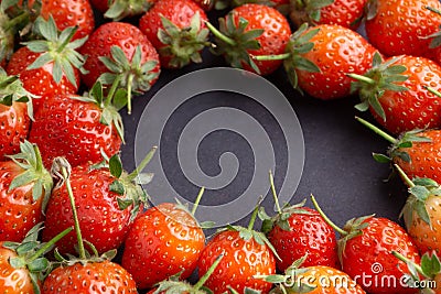 Strawberry on dark background with selective focus and crop fragment Stock Photo