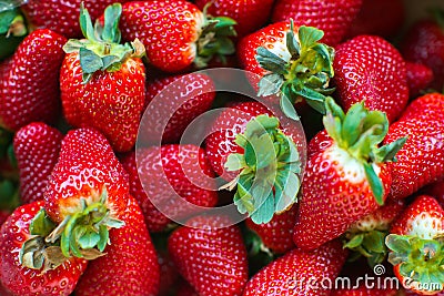 Strawberry. Fresh and ripe organic Strawberries Background, Vegetarian healthy food backdrop Stock Photo