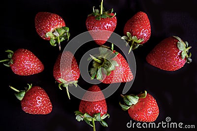 Strawberry fruit pattern on black background Stock Photo