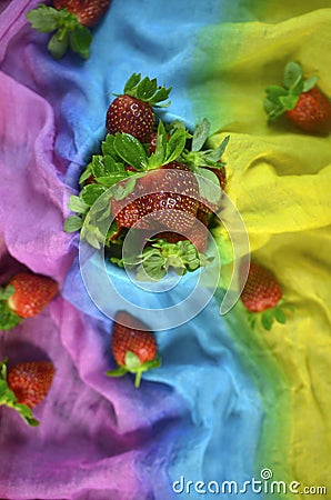 Strawberry fruits on colourful cloth background Stock Photo