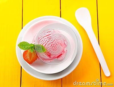 Strawberry icecream on yellow table Stock Photo