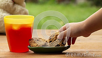 Strawberry juice and cookies on table. Stock Photo