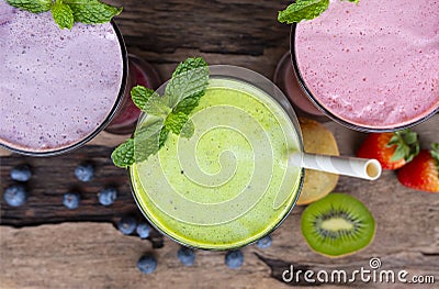 Strawberry kiwi and blueberry smoothies fruit for slimming on wooden backgroundfrom the top view. Stock Photo