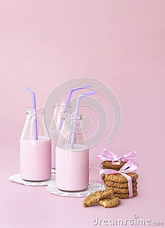 Strawberry milk and cookies on pink Stock Photo