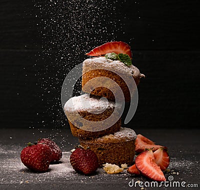 Strawberry muffin blackground sugar snow powder cake cupcake baked Stock Photo