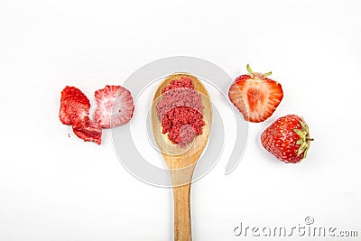 Strawberry powder made of freeze dried strawberries for sprinkle. Flavor and color ingredient for food. Top view white minimal ba Stock Photo