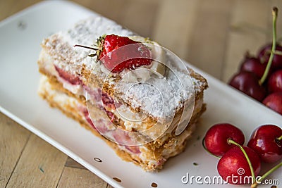 Strawberry puff mille-feuille with cherry Stock Photo