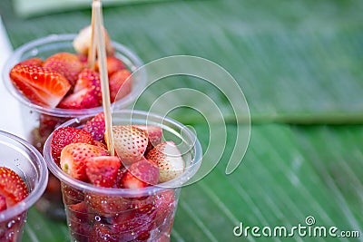 Strawberry sliced in plastic cup for sale Stock Photo