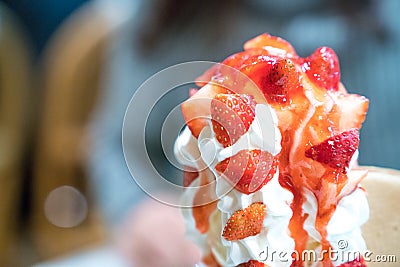 Strawberry sundae tower ice-cream with whip cream and strawberry sauce Stock Photo