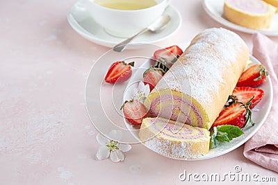 Strawberry swiss roll cake on white plate Stock Photo