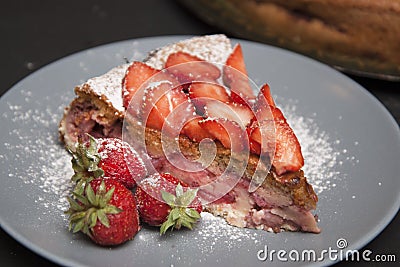 Strawberry Tart Piece. homemade Fruit Berry Cake Tart Pie with Strawberries. Black Board. Stock Photo