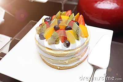 Strawberry Tarts variety fruit pancake silver cake spatula Grand Dessert Buffet in Luxury Restaurant Hotel Stock Photo