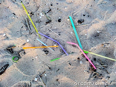 Straws are waste on beach Stock Photo