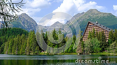 Strbske pleso. Misty horizons blue tones. High tatras mountains. Vysoke tatry. Autumn forest. Reflection in lake Stock Photo