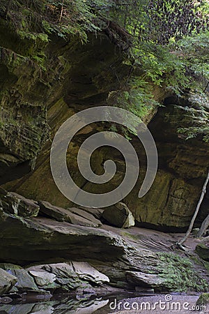 Stream at base of cliff Stock Photo