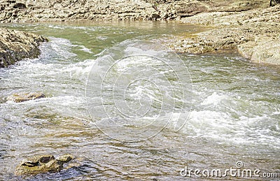 Stream of water flowing in the river at Suratthani Stock Photo