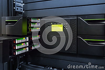 Streamer, tape library for data backup in the server rack in the datacenter Stock Photo