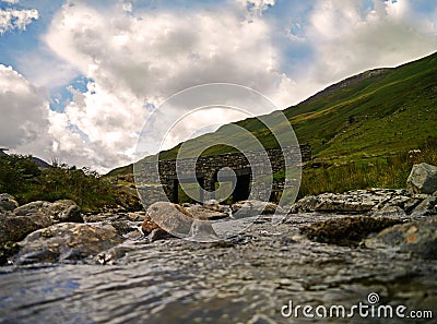 Streams run under a bridge Kirkstone Pass, Cumbria Stock Photo