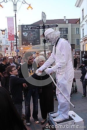 Man in white - living statue handshake Editorial Stock Photo