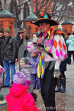 Street actors and ordinary people celebrate Shrovetide. Editorial Stock Photo