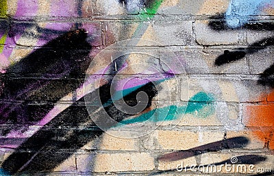 Street art. Abstract background. Chaotically painted brick walls with multi-colored paint Stock Photo