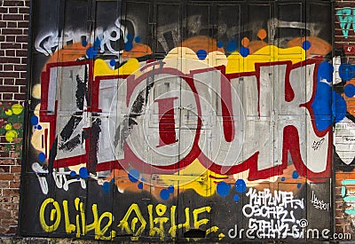 Street art. Colorful graffiti on the wall. Abstract detail of a graffiti. Editorial Stock Photo