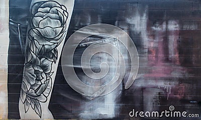 Street art graffiti with abstrac art of a woman Editorial Stock Photo