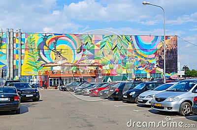 Street art on Oktyabrskaya street. Graffiti with natural motifs on wall of industrial building, Minsk, Belarus Editorial Stock Photo