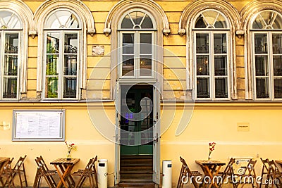 A street bad square at the entrance to a vintage cafe in the city of old Europe Editorial Stock Photo