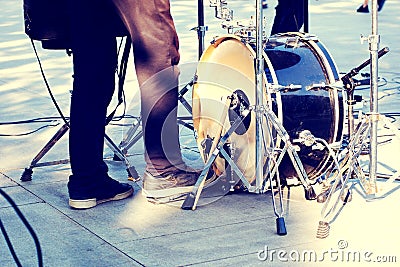 Street musicians, kick drum and drummer legs in action Stock Photo