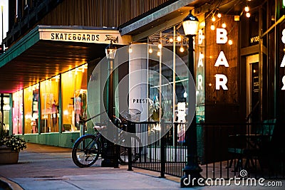 Street with a bar and a skateboard shop in the early morning in downtown Boise, Idaho, USA. Editorial Stock Photo