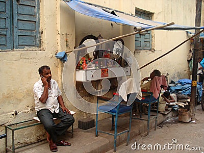 Street barber/hairdresser shop in Delhi, India Editorial Stock Photo