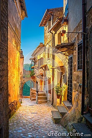 A street in a beautiful small medieval village in Tuscany at sunset Stock Photo