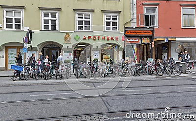 Street bicycle parking and pharmacy in Graz, Austria. Editorial Stock Photo