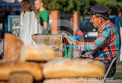 Street busker playing organette Editorial Stock Photo