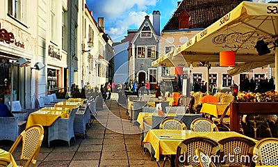 Street cafe in old town of Tallinn Estonia 30,10,2019 travel to Europe lifestyle city urban tourist walking Editorial Stock Photo