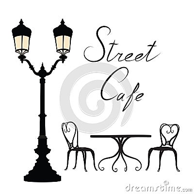 Street cafe - table, chairs, streetlight and lettering City life Stock Photo