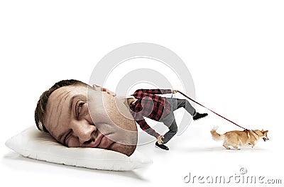 Big head on small body lying on the pillow Stock Photo