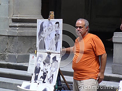 Street caricature painter in Florence Editorial Stock Photo