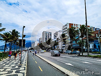 Daily street with cars, people and palms Editorial Stock Photo
