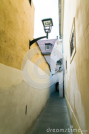 Narrow street in center of the old city Sibiu, Transylvania, Romania. Stock Photo