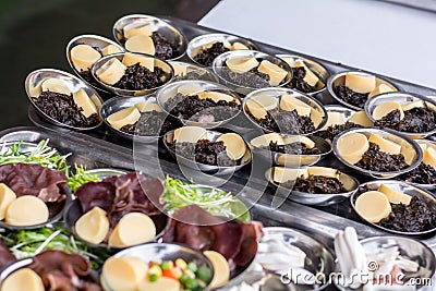 Street Chinese appetizer. Variety of dumplings or dim sum on the small metal plate Stock Photo