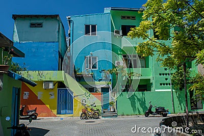 Street with colourful houses at the Villingili island Editorial Stock Photo