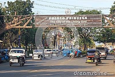 Street crowded with many tricycles, very common in the Philippines Editorial Stock Photo