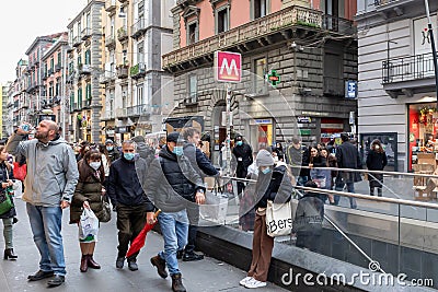 Street crowded with people with protective masks, in Naples, Italy Editorial Stock Photo