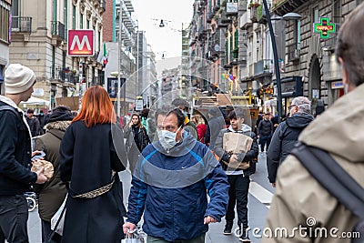 Street crowded with people with protective masks, in Naples, Italy Editorial Stock Photo