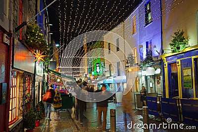 Street decorated with Christmas lights at night Stock Photo