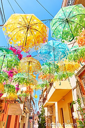 Street decorated with umbrellas of different colours Editorial Stock Photo