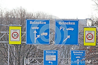 Street direction sign Heineken brewery in Zoeterwoude in the Netherlands. Editorial Stock Photo